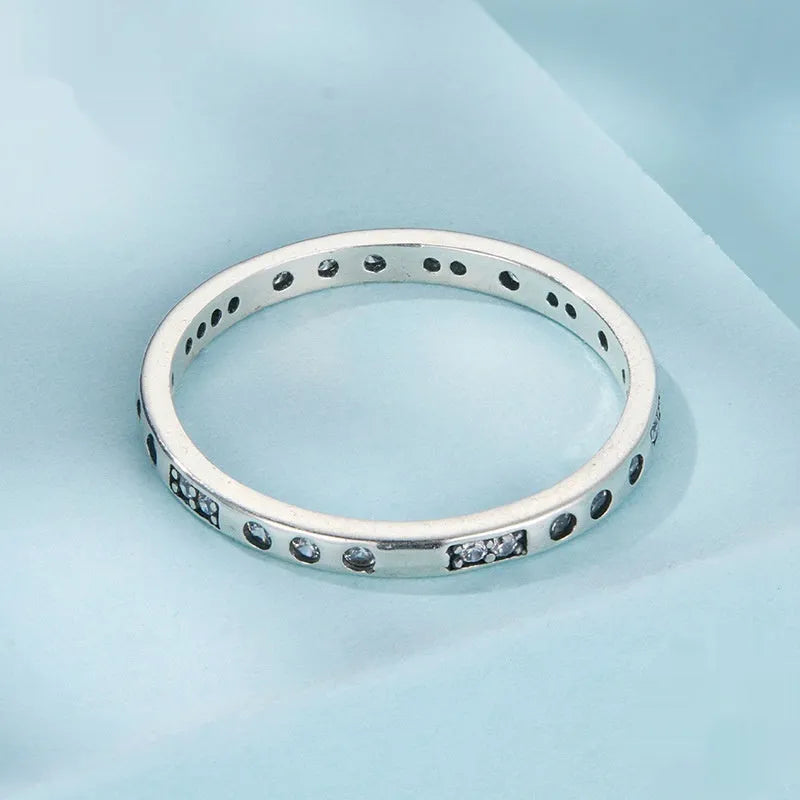 Oxidised black silver 'I Love You' moss code ring on a simple band for women.