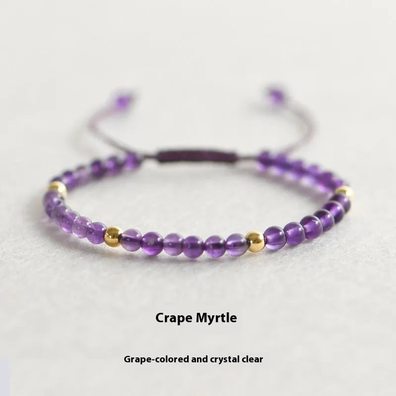 Handmade purple amethyst and 14K gold bracelet with 4mm round beads on a wrist.