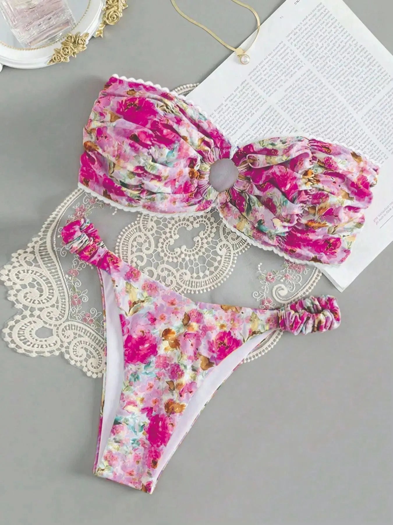 Blue floral print bikini set with lace trim on a sleeveless tube top and matching briefs.