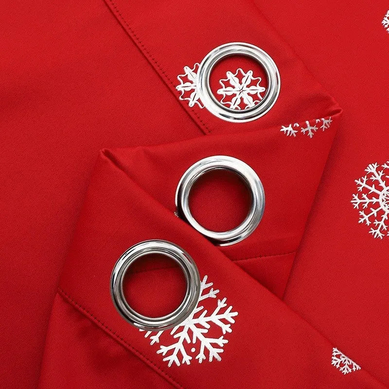 Red or green snowflake pattern shade cloth curtain with coordinating lace loops and iron hoops
