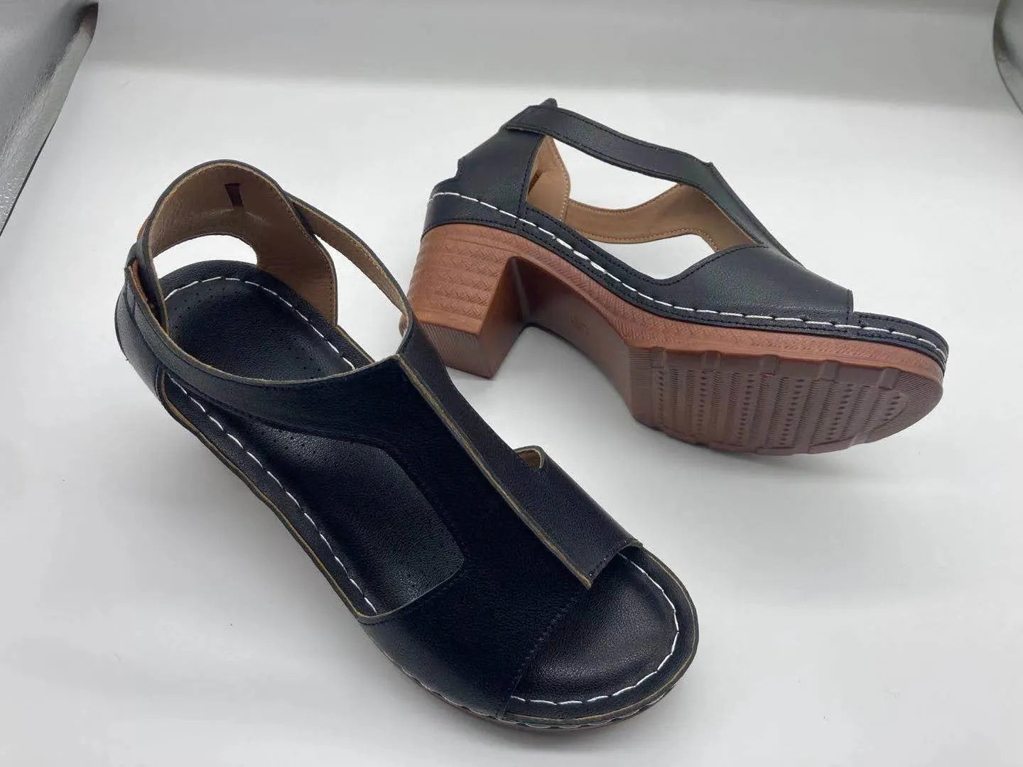 Women's peep toe wedge sandal with buckle on low heel, open fish mouth toe, in light brown