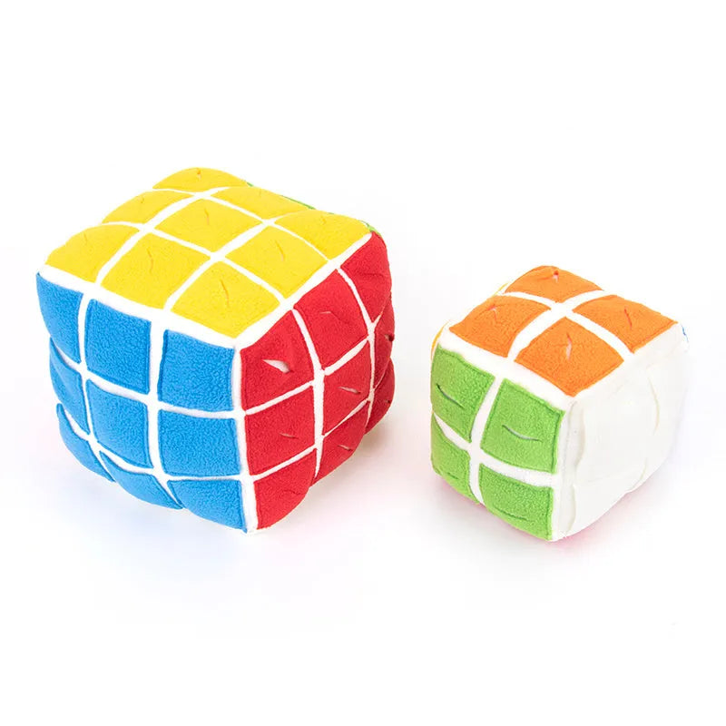 Pet Rubik's Cube sniffing toy in polar fleece fabric with treats visible, 15cm cube on a light background