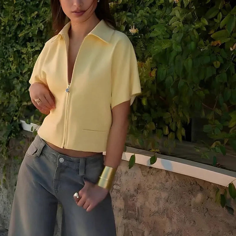 Loose-fit short-sleeve polyester casual top on a hanger, shown in white, black, and yellow colour options.