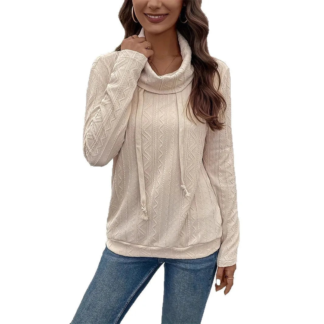 Apricot coloured long sleeve hooded pullover sweater on a hanger.