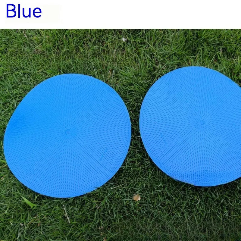 Yellow football training marker disc on grass field showing 23cm diameter flat design