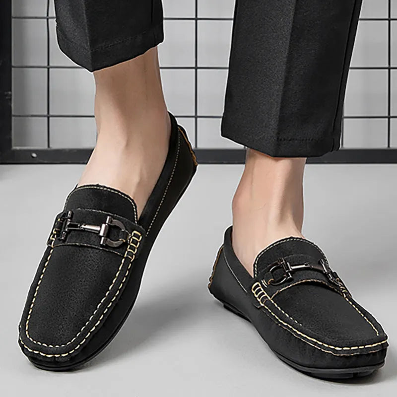 Men's beige cowhide leather slip-on loafers with round toe and rubber sole on a neutral background.