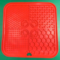 Silicone dog slow food mat in black with raised ridges to slow eating, anti-scatter design
