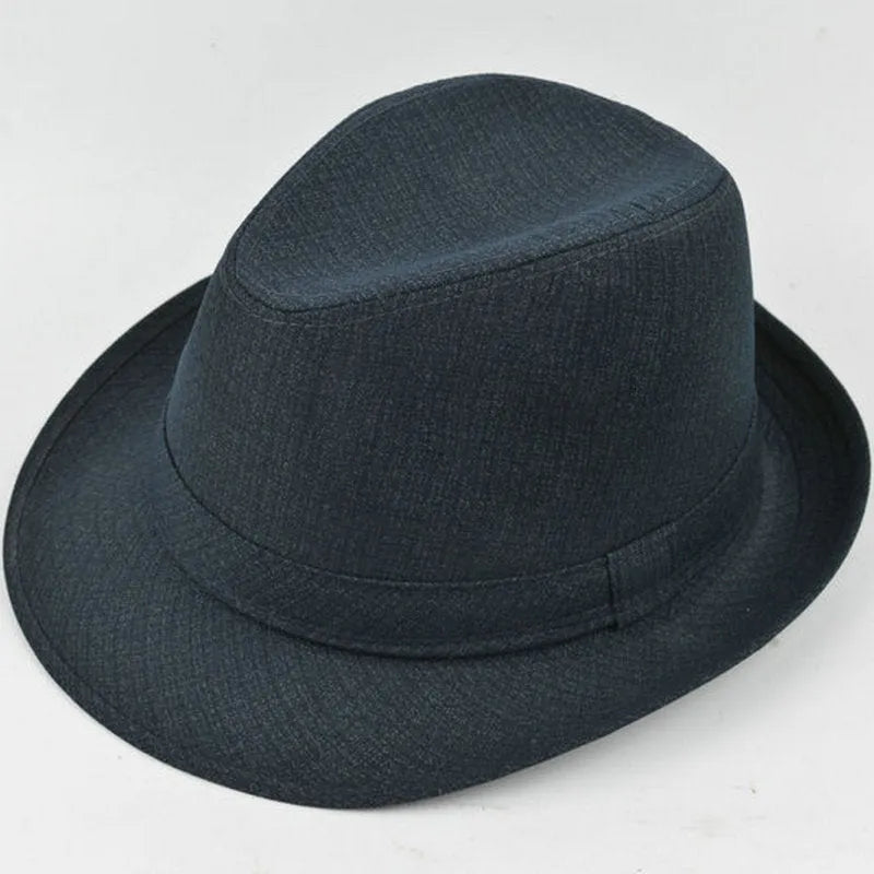 Classic brown fedora hat with structured crown and wide brim on a wooden stand