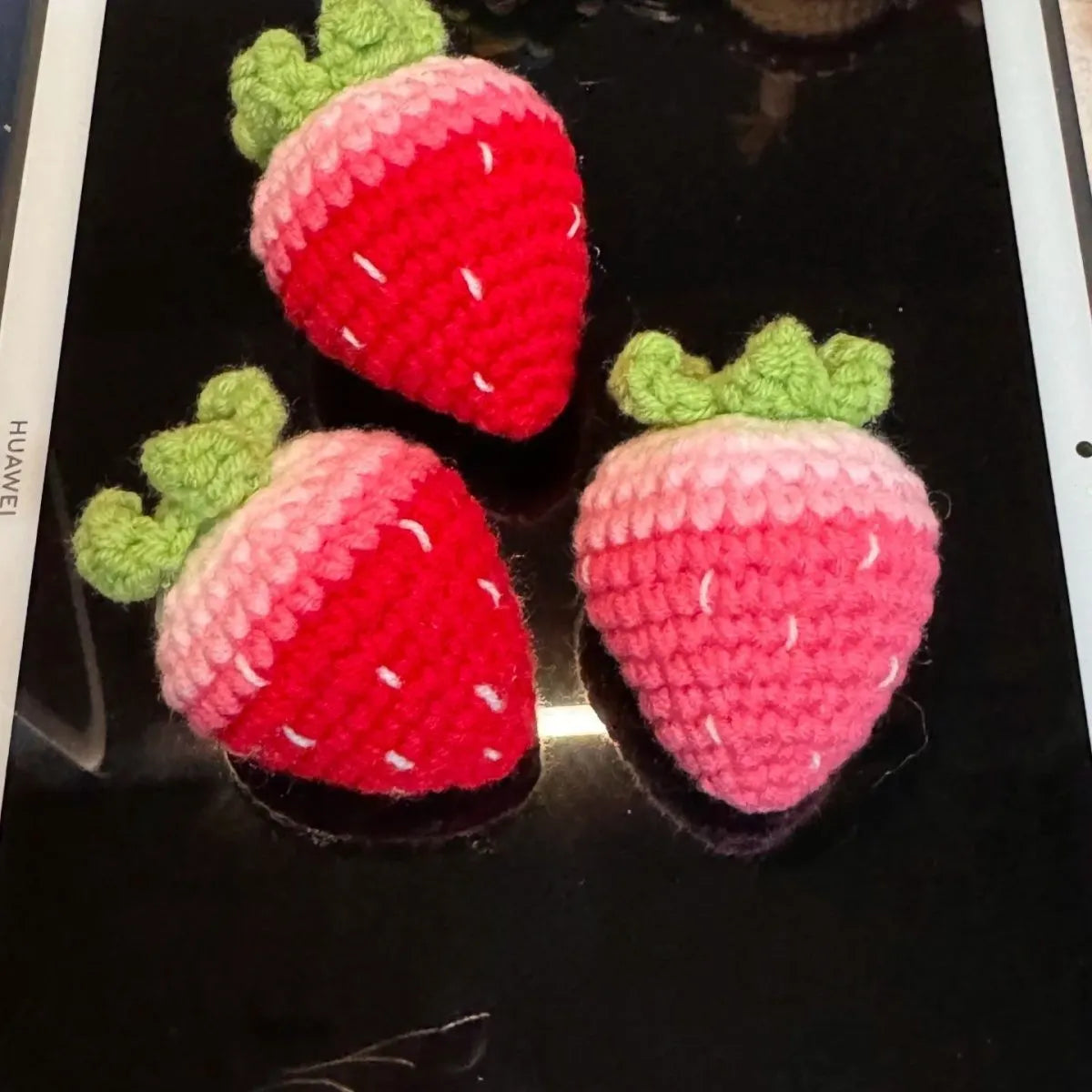 Plush wool strawberry pendant keychain charm in pink or red colour.