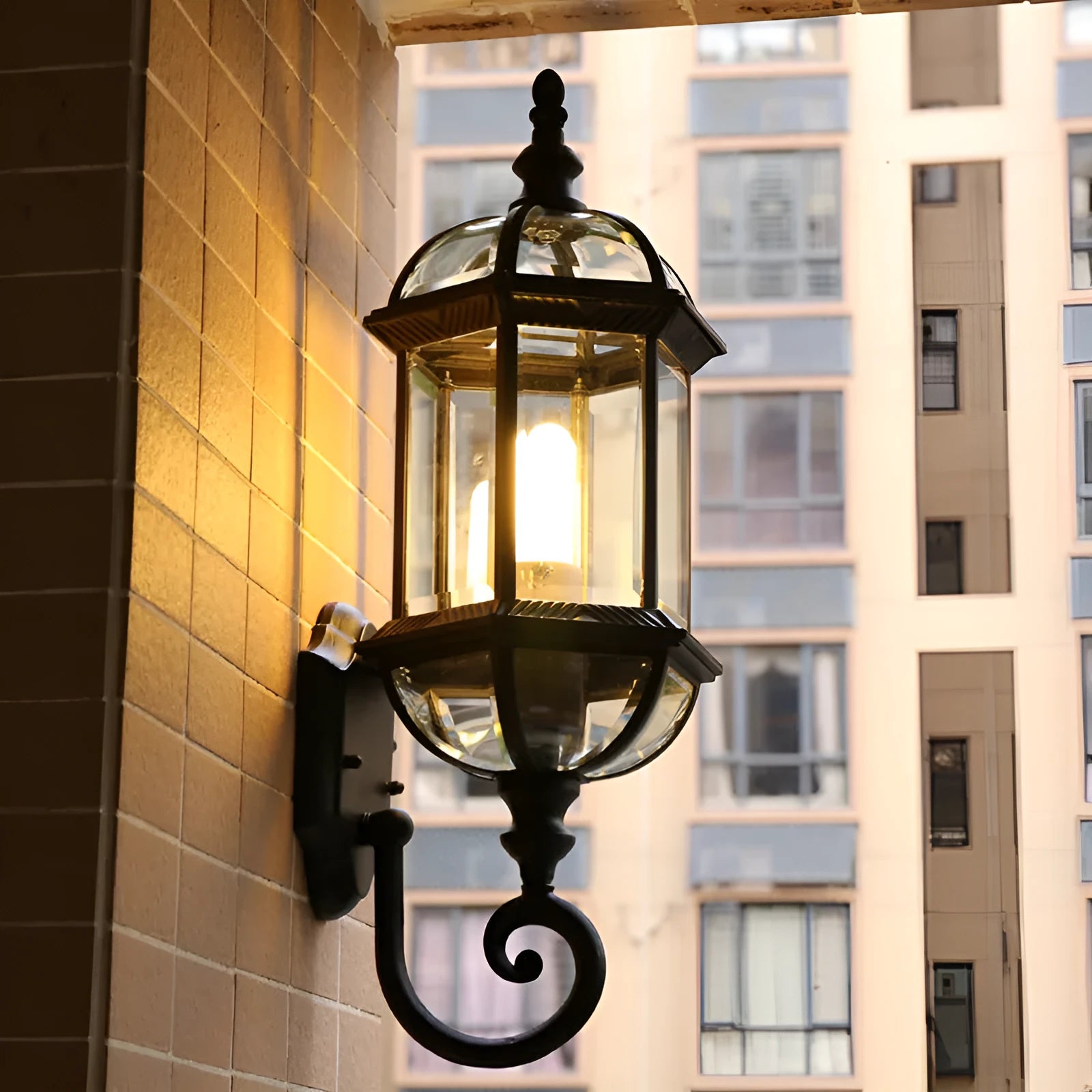 Gold and black outdoor aluminium wall lamp with a three-layer, eight-inch waterproof design.
