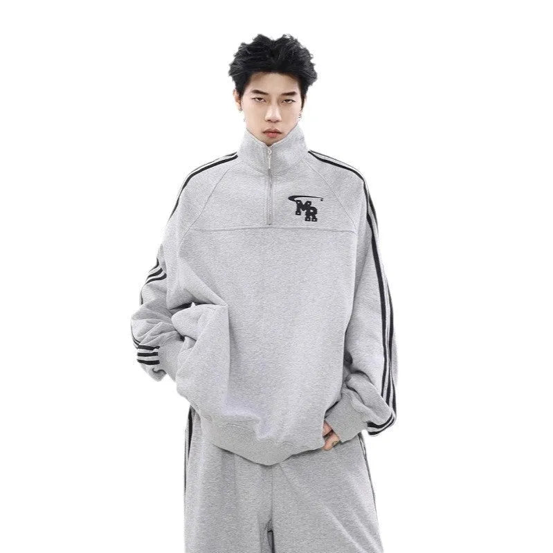 Black Hong Kong style stand collar couple hoodie sweater on a hanger.