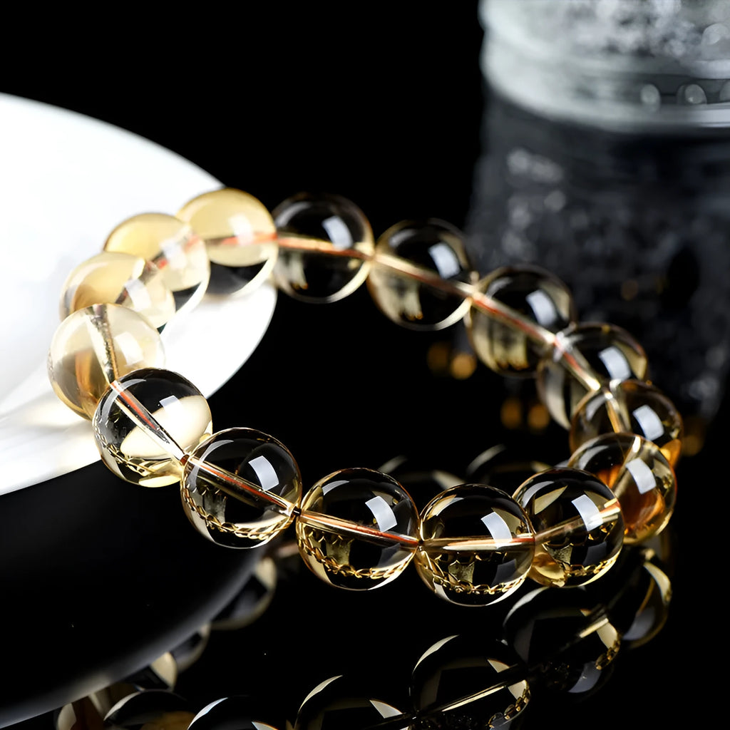 Natural citrine scattered beads ball bracelet showing golden polished stones on a wrist, available in 7A and 6A grades.