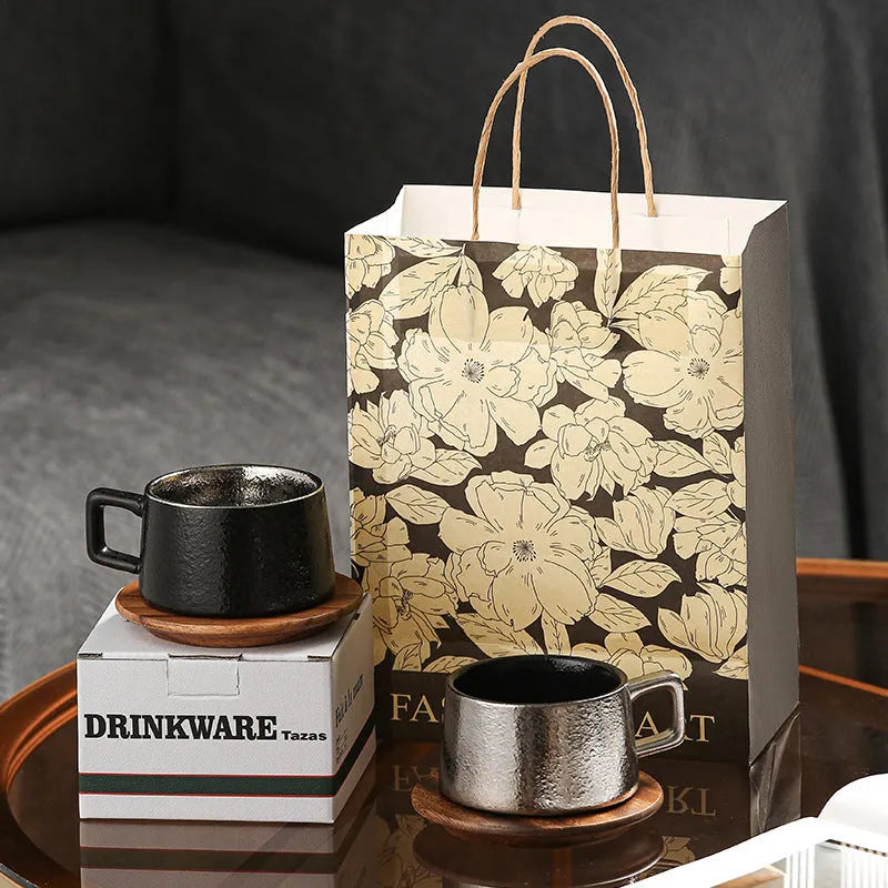 Gold and silver-plated gift boxes containing a solid colour 250ml tumbler cup and optional gift bag.