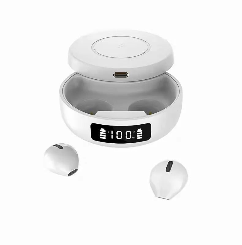 Mini black semi-in-ear wireless headphones with their compact wireless charging case on a table.