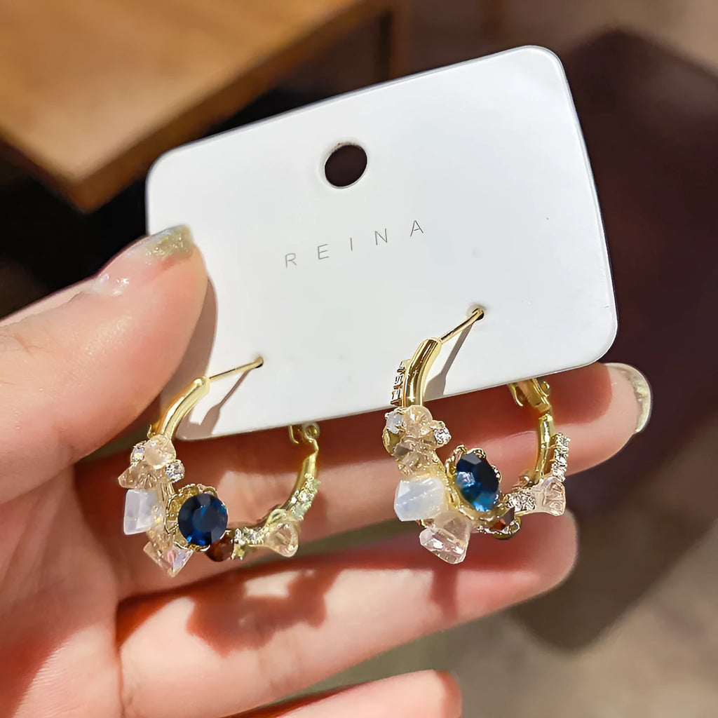 Green flower earrings with real gold plating, 925 silver needle, and diamond processing on an alloy body, gold colour