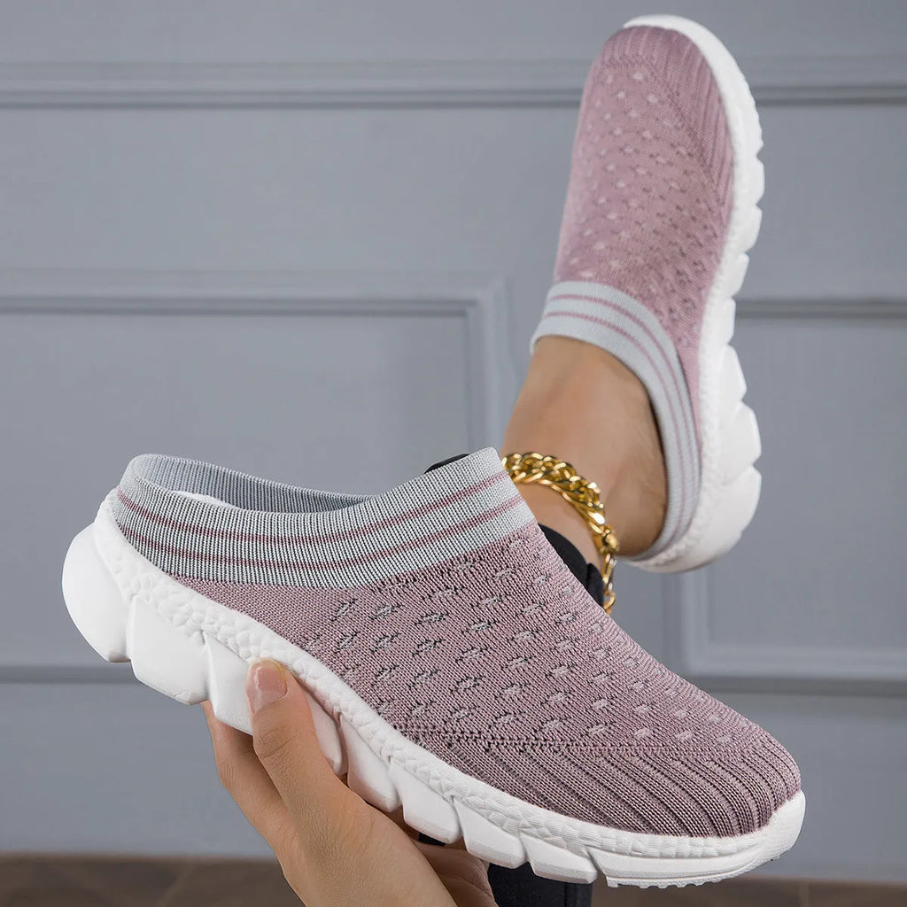 Women's black, pink, and purple Flyknit semi-slipper shoes with striped pattern and hollowed-out design.