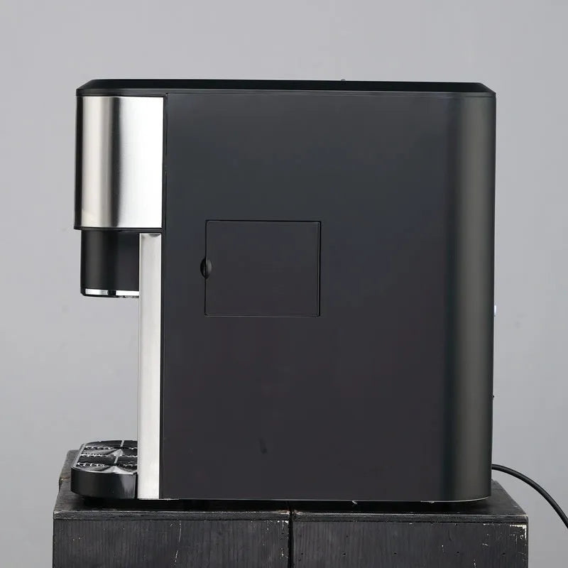 Black desktop ice making machine with ice crushing and cold water dispensing functions on countertop