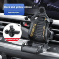 Gold coloured car air vent mobile phone holder with 360-degree rotating head mounted on a car dashboard vent.