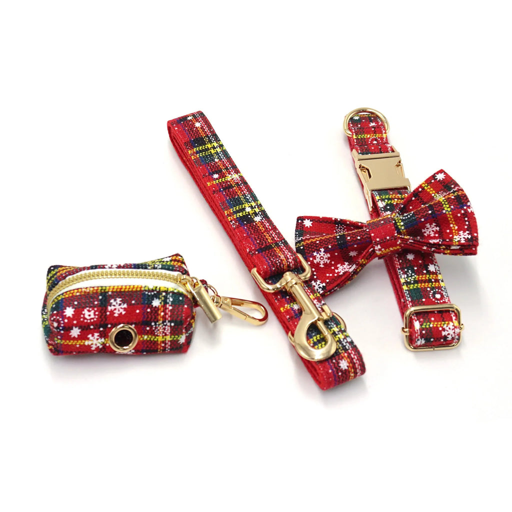 Red Christmas dog suit set with collar, leash, bow, and chest-back harness on a festive background.