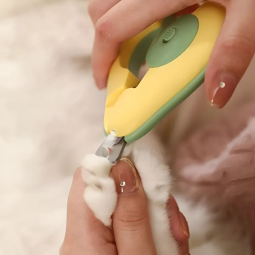 Professional LED pet nail clipper for small dogs and cats in green, pink, or white with safety guard.
