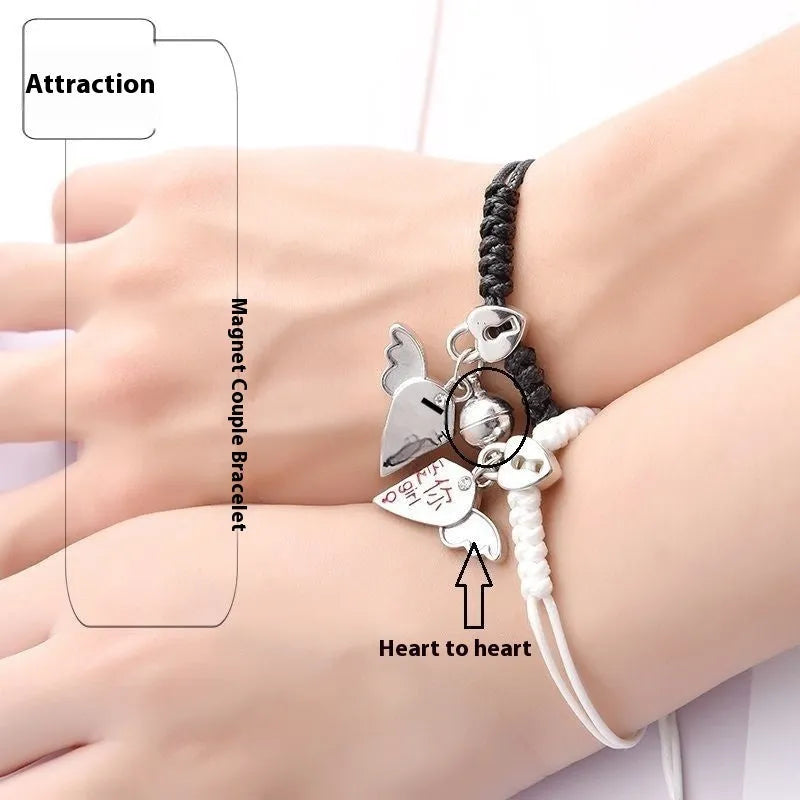 Magnet suction couple bracelets with alloy construction and various pendant designs including crowns and hearts
