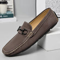 Men's beige cowhide leather slip-on loafers with round toe and rubber sole on a neutral background.