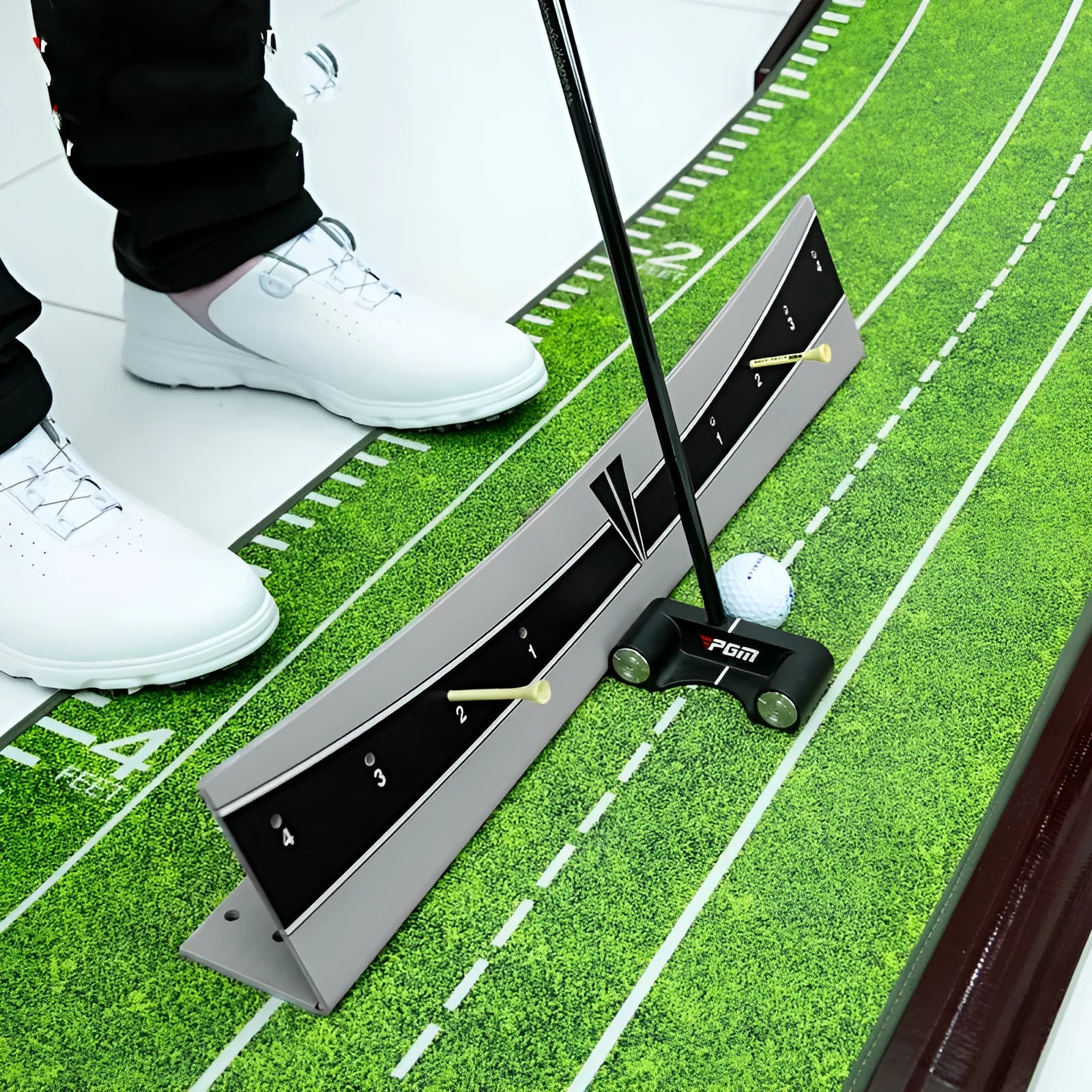 Golf putter with attached adjustable trajectory balance simulator, a PVC training aid for stroke feedback.