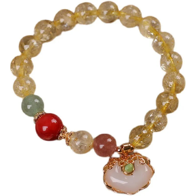 Women's adjustable alloy bracelet with a detailed natural citrine jade ruyi pendant in yellow tones.