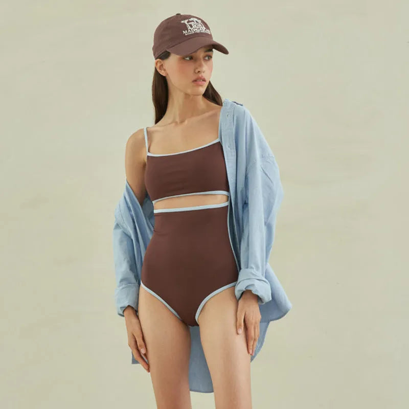 Brown women's one-piece triangle swimsuit made from nylon fabric on a mannequin.