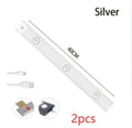 Silver ultra-thin USB rechargeable LED light strip with motion sensor for cabinet mounting.