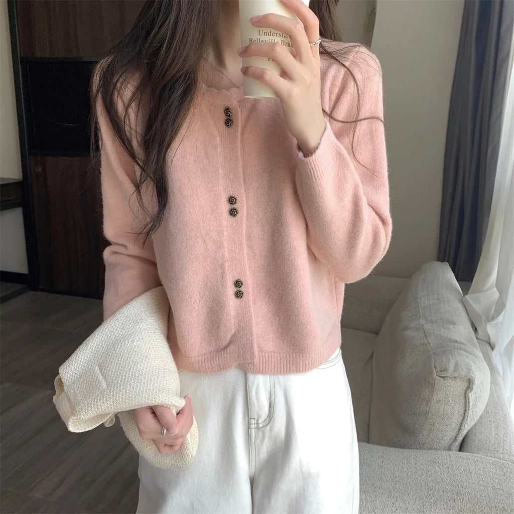 Women's long-sleeved acrylic fibre cardigan coat in milky white colour showing regular fit