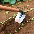 Agricultural pointed hoe with a steel horse tip and flat hoe blade for soil breaking