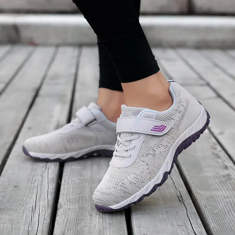 Women's low-top wedge heel shoes in grey purple with velcro strap and mesh upper.
