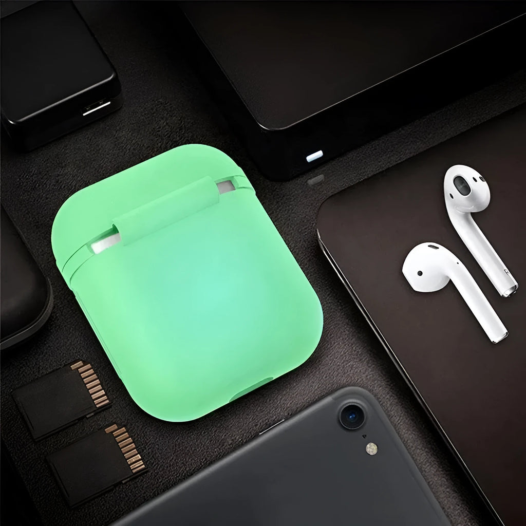 Luminous blue flip-top silicone protective case for Apple AirPods on a dark surface