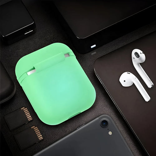 Luminous blue flip-top silicone protective case for Apple AirPods on a dark surface