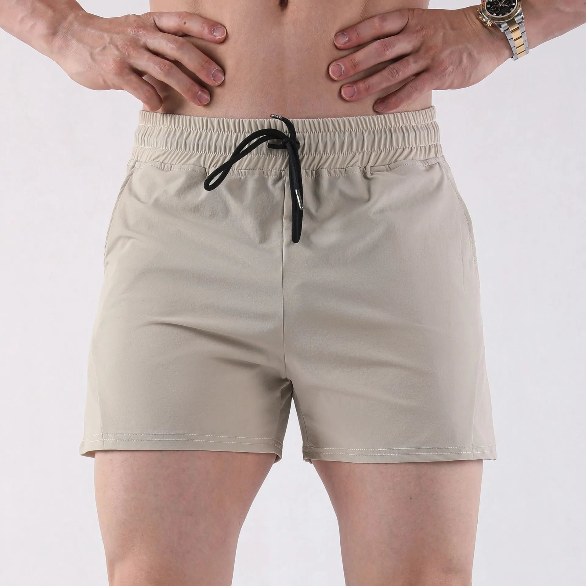 Men's lightweight polyester basketball shorts in grey, shown for summer sports wear.