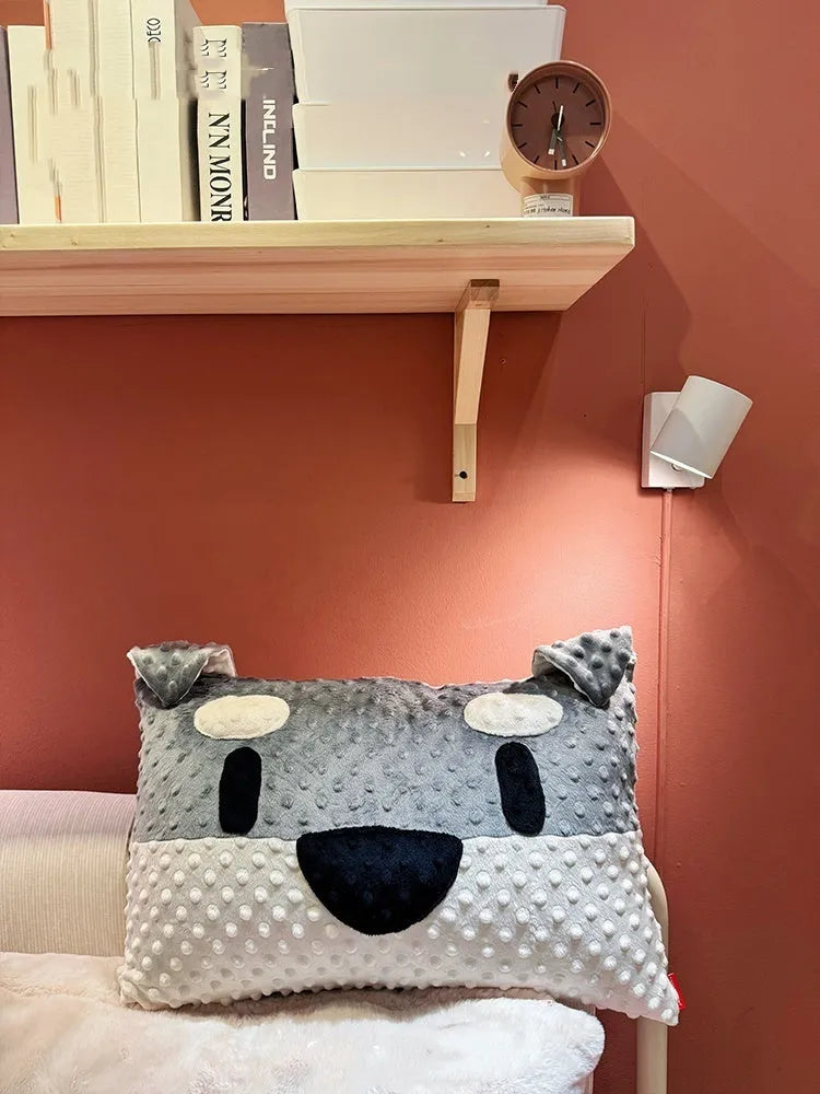 Grey and white dog breed decorative pillow cushion on a sofa, measuring 50cm by 35cm.