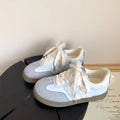 Women's flat casual shoes with lace bow decoration, colour-block design, mid-cut synthetic PU upper, and vulcanised rubber sole