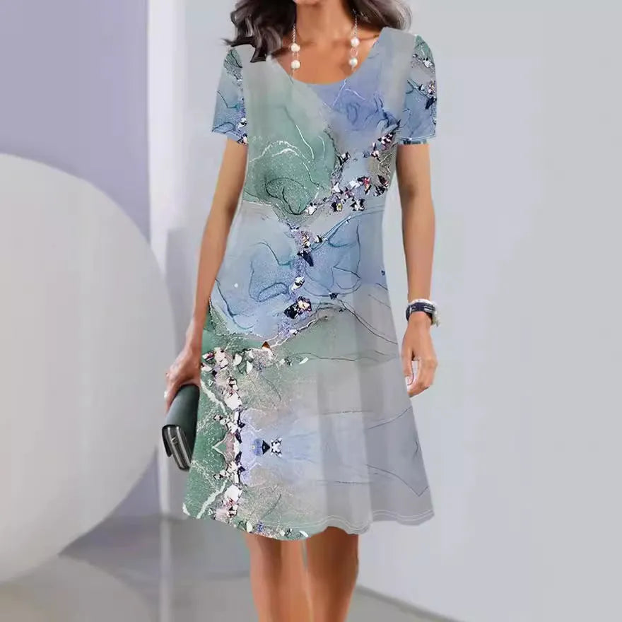 Women's light blue floral print Ice Silk mid-length dress with short sleeves and round neck.