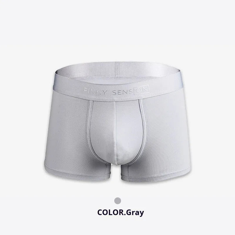 Men's solid colour cotton boxer shorts in black, shown in a loose fit style.