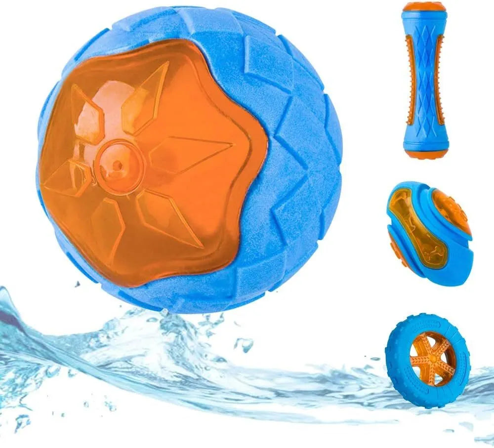 Set of three TPR dog toys: a red ball, a blue barbell, and an orange tire, floating in water.