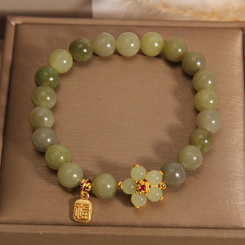 Women's casual fashion bracelet in a grey jade colour with alloy metal construction.