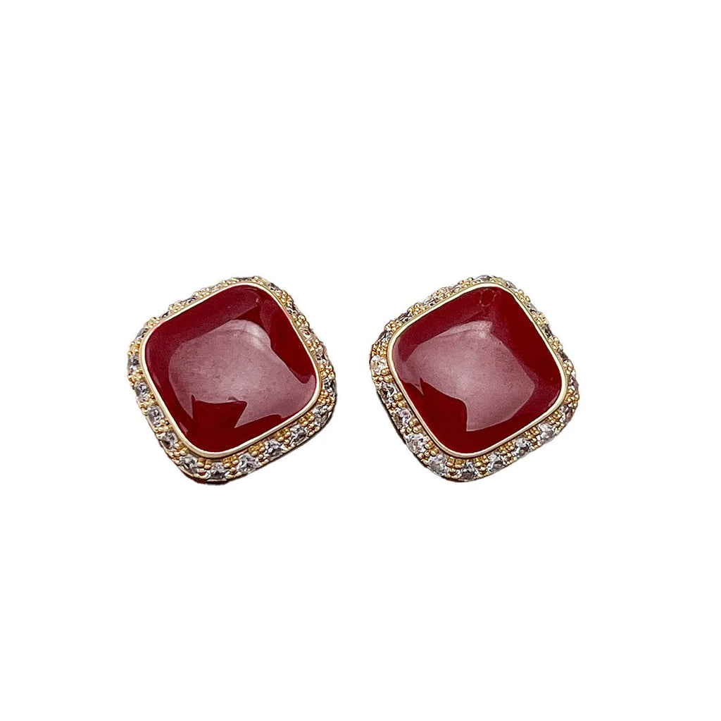 Red geometric square alloy earrings with clip-on fastening and embedded square design elements