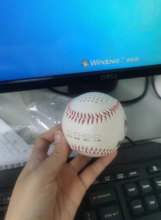 Baseball Home Bluetooth Speaker in white with orange stitching, compact wireless speaker with USB charging port
