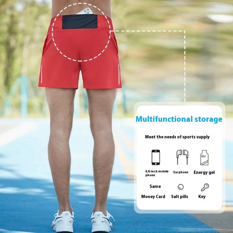 Men's black off-road running shorts with a loose fit and high waist, shown for running activity.