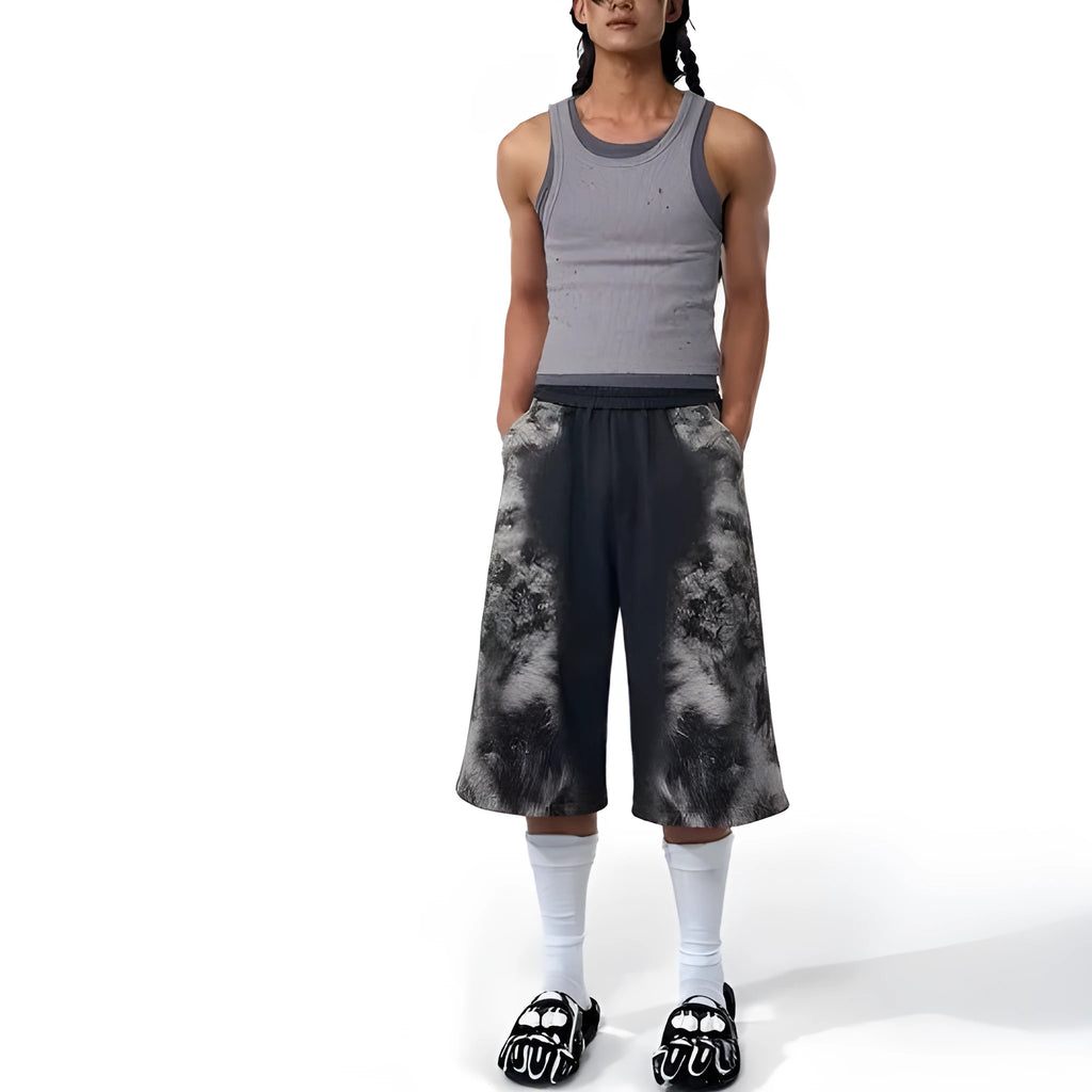 Unisex grey streetwear co-ord set featuring a printed hoodie, loose trousers, and seven-inch shorts laid flat