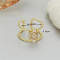 Adjustable open ring in copper-plated gold with asymmetrical U-shape design