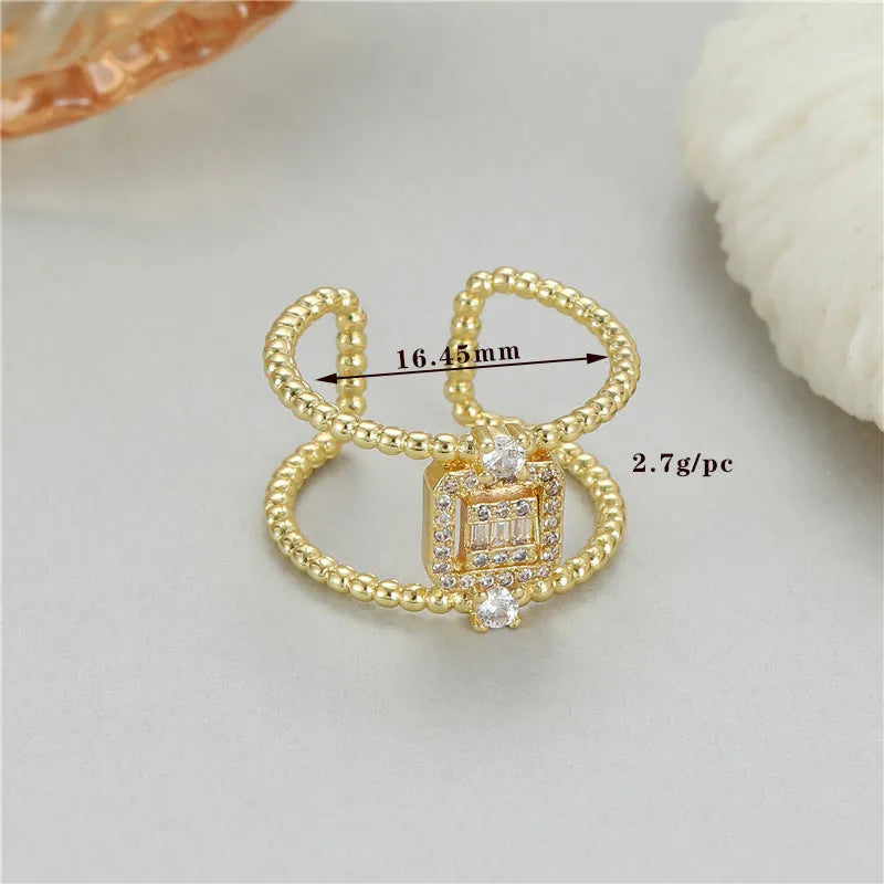 Adjustable open ring in copper-plated gold with asymmetrical U-shape design