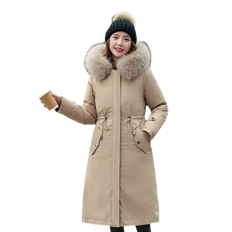 Women's long beige fleece trench coat with two-way zip, shown on a model.