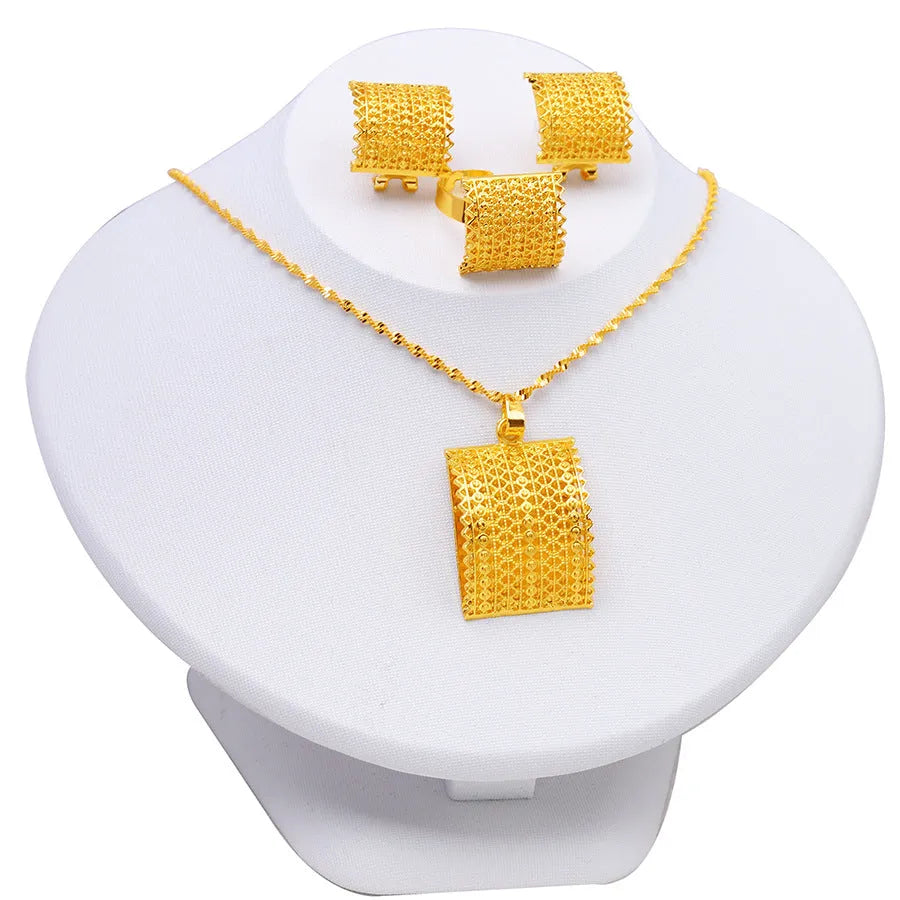 Golden copper bridal jewellery set showing necklace, earrings and ring combination for wedding accessories